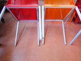 two chairs that are sitting next to each other in a room