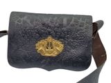 an image of a black leather purse with a gold buckle