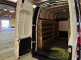 a white van with the door open in a building