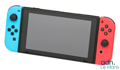 a nintendo switch lite with a blue and red controller