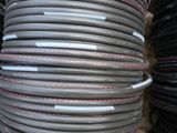 a lot of black and red hoses stacked on top of each other