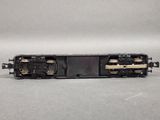 a close up of a toy train on a white surface