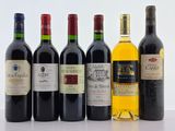 plusieurs bouteilles de vin sont alignées sur une table