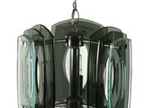 a glass chandelier hanging from a chain