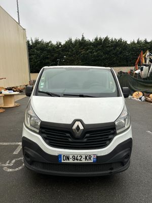 a white van that is parked in a parking lot