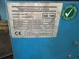 a close up of a blue machine with a label on it