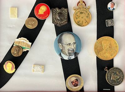 a picture of a collection of medals and medals on a black ribbon