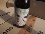 a bottle of beer sitting on top of a box
