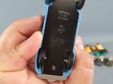 a person holding a remote control in their hand