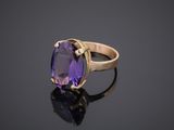 an amethorate ring set in 18k yellow gold with an oval amethorate