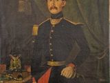 portrait of a man in a military uniform standing in front of a table with a bird on it