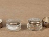 three salt and pepper shakers sitting on a table