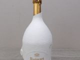 a bottle of wine that is sitting on a table