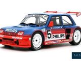 the car is blue and red with a white stripe on the side