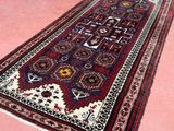 an oriental rug on a pink floor with a pink background