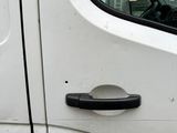 a close up of a white van with a door handle