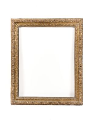 a gold picture frame on a white wall with a white background