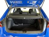 the back of a blue car with its trunk open