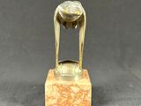 an image of a bronze statue of a woman on a marble base