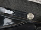 a close up of a hat with a button on it