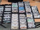 a lot of glasses that are sitting on a table