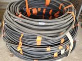 a large coil of steel wire is stacked on top of each other
