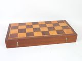 an image of a wooden chess board sitting on top of a white surface