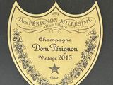 a label on a bottle of champagne on a black table