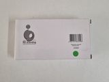 a close up of a white box with a green sticker on it