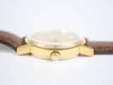 an image of a close up of a watch on a white surface