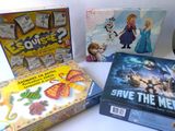 several board games are sitting on a table next to each other