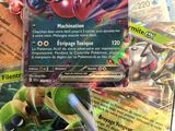 several pokemon cards sitting on top of each other on a table