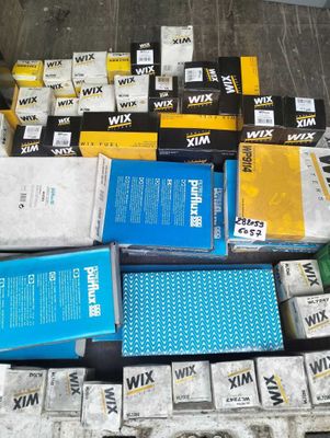 a pile of boxes and boxes of books on the floor