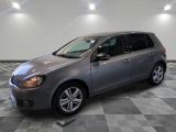 the volkswagen golf is parked in a clean room with checkered flooring