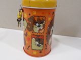 a small orange tin with a cartoon character on it