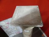 a cement object that is sitting on top of a table