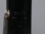 a close up of a black pen with a silver tip