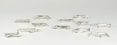 silver plated animal figurines on a white background
