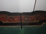 a black and red rug on the floor next to a white door