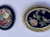 two framed pictures of birds and flowers on the wall