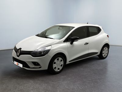 a white car is parked in a room with a gray floor