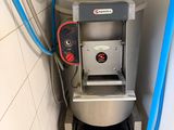 a machine that is sitting in the corner of a room