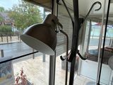 a lamp that is next to a window in a room