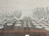 a lot of wine glasses sitting on a table
