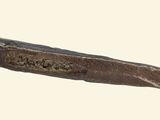 a close up of a piece of metal with a handle
