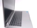 a silver laptop computer sitting on top of a white table