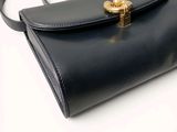 an image of a black purse on a white background