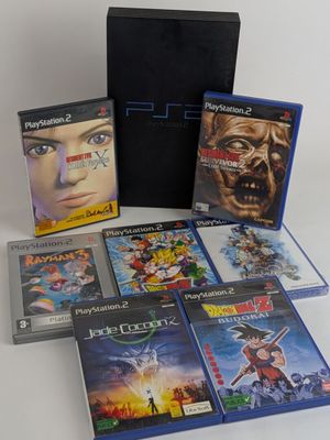 a box of games including a video game and a game case