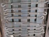 a lot of wrenches that are on a pallet