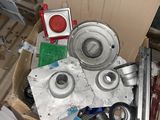 a pile of assorted metal items in a box